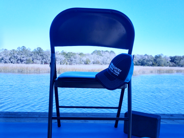 Chair on a dock on the chair is a lowcountry power yoga hat
